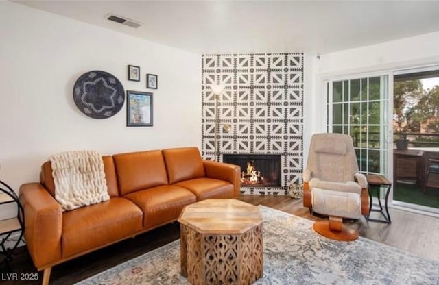 2200 S Fort Apache Rd Unit 2217, Las Vegas, NV 89117 - living area featuring wood finished floors and a fireplace
