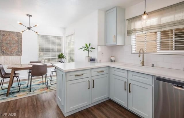 2200 S Fort Apache Rd Unit 2217, Las Vegas, NV 89117 - kitchen featuring stainless steel dishwasher, a chandelier, a peninsula, and dark wood-type flooring