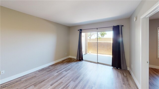 8070 W Russell Rd Unit 1046, Las Vegas, NV 89113 - unfurnished room with wood finished floors and baseboards