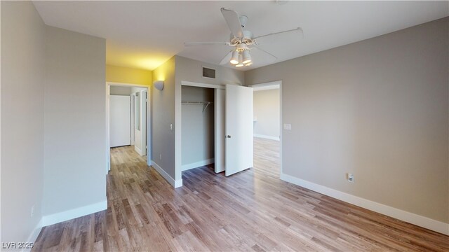 8070 W Russell Rd Unit 1046, Las Vegas, NV 89113 - unfurnished bedroom featuring light wood-type flooring, a closet, and a ceiling fan