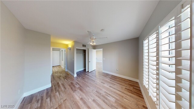8070 W Russell Rd Unit 1046, Las Vegas, NV 89113 - empty room with light wood-style flooring, a ceiling fan, and a smoke detector