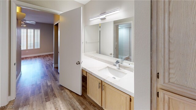 8070 W Russell Rd Unit 1046, Las Vegas, NV 89113 - bathroom with wood finished floors, vanity, and a ceiling fan