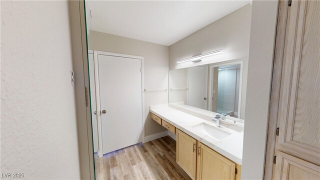 8070 W Russell Rd Unit 1046, Las Vegas, NV 89113 - bathroom with vanity and wood finished floors