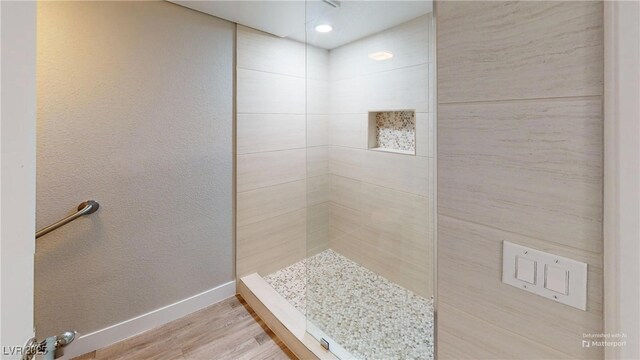 8070 W Russell Rd Unit 1046, Las Vegas, NV 89113 - full bath featuring a tile shower and wood finished floors