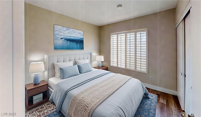 8070 W Russell Rd Unit 1046, Las Vegas, NV 89113 - bedroom with baseboards and wood finished floors