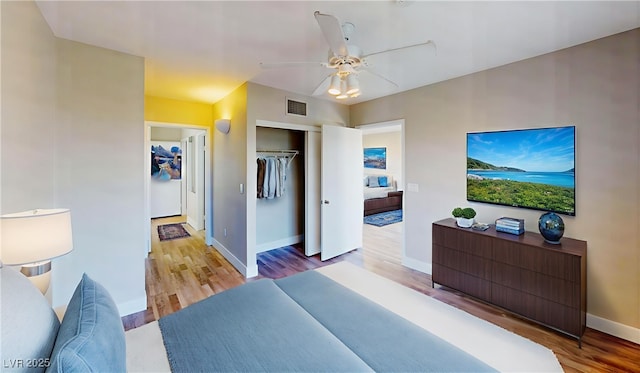 8070 W Russell Rd Unit 1046, Las Vegas, NV 89113 - bedroom with wood finished floors, a closet, and a ceiling fan