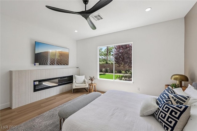 2297 Aria Dr, Henderson, NV 89052 - bedroom with wood finished floors, recessed lighting, and a ceiling fan