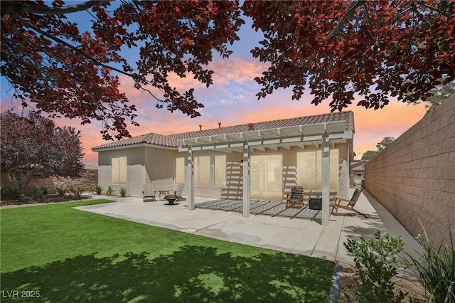 2297 Aria Dr, Henderson, NV 89052 - back of house at dusk with a tiled roof, a patio area, stucco siding, and a pergola