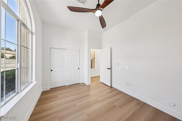 2297 Aria Dr, Henderson, NV 89052 - unfurnished bedroom featuring light wood-style floors, a closet, and ceiling fan