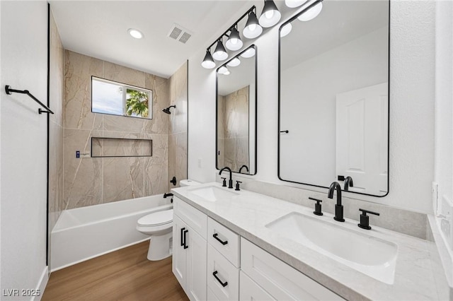 2297 Aria Dr, Henderson, NV 89052 - bathroom featuring double vanity, washtub / shower combination, and wood finished floors