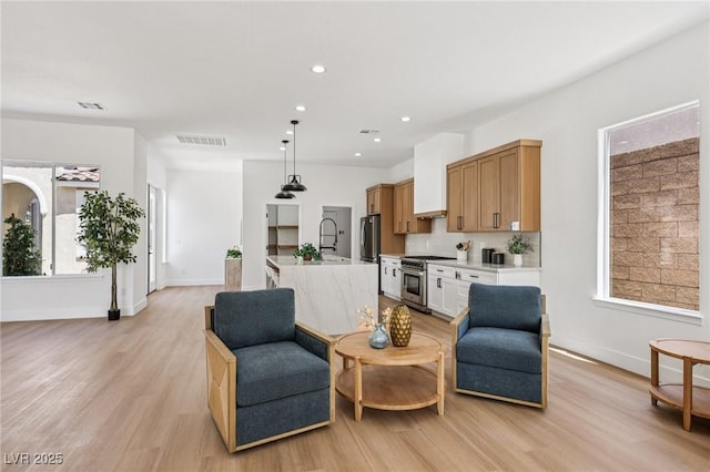 2297 Aria Dr, Henderson, NV 89052 - living room featuring light wood-style flooring and recessed lighting