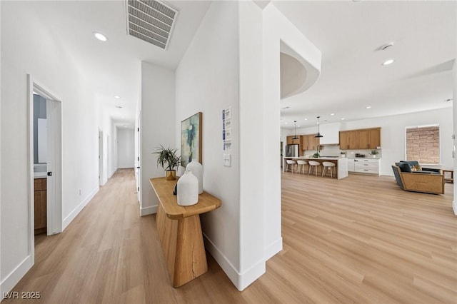 2297 Aria Dr, Henderson, NV 89052 - hall with light wood finished floors and recessed lighting