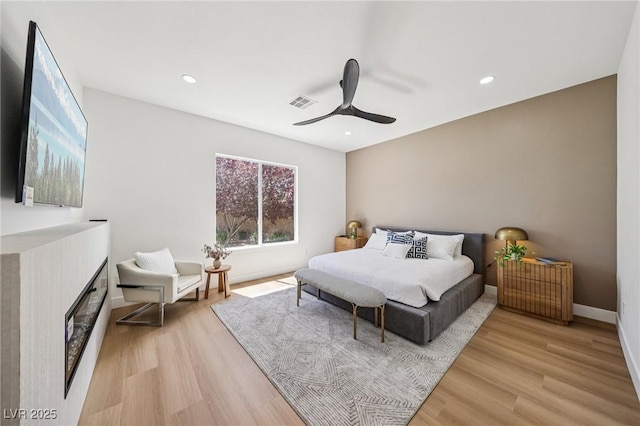 2297 Aria Dr, Henderson, NV 89052 - bedroom featuring light wood-style flooring, a ceiling fan, and recessed lighting