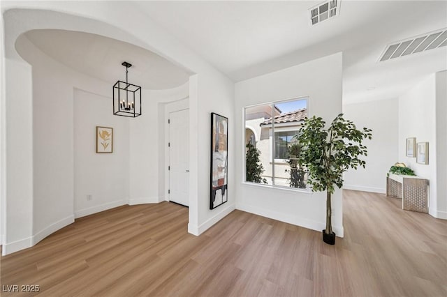 2297 Aria Dr, Henderson, NV 89052 - entrance foyer featuring light wood-type flooring and a chandelier