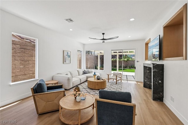 2297 Aria Dr, Henderson, NV 89052 - living room featuring light wood-style floors, ceiling fan, and recessed lighting