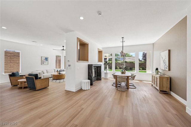 2297 Aria Dr, Henderson, NV 89052 - living room with light wood-style floors, recessed lighting, and a fireplace