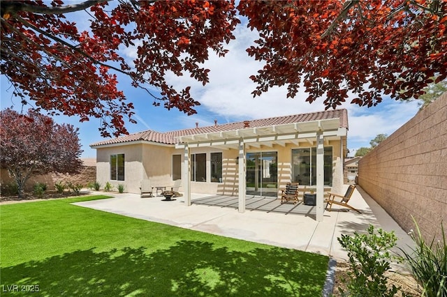 2297 Aria Dr, Henderson, NV 89052 - back of house with a tiled roof, stucco siding, a pergola, and a fenced backyard