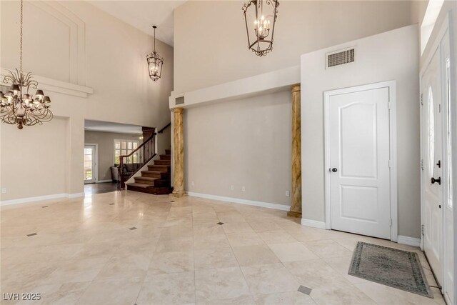 1054 Broomfield Dr, Henderson, NV 89074 - entrance foyer with a chandelier, a high ceiling, and stairway