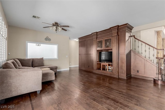1054 Broomfield Dr, Henderson, NV 89074 - living area featuring dark wood-style floors, stairs, and a ceiling fan