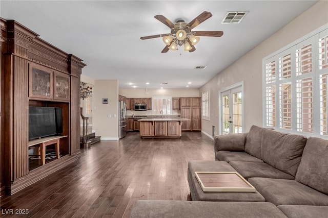 1054 Broomfield Dr, Henderson, NV 89074 - living room featuring ceiling fan, dark wood-type flooring, and recessed lighting