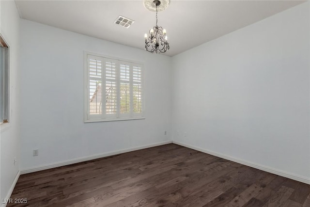 1054 Broomfield Dr, Henderson, NV 89074 - unfurnished room with a chandelier and dark wood-style floors