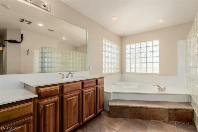 1054 Broomfield Dr, Henderson, NV 89074 - full bath featuring vanity, a garden tub, and recessed lighting
