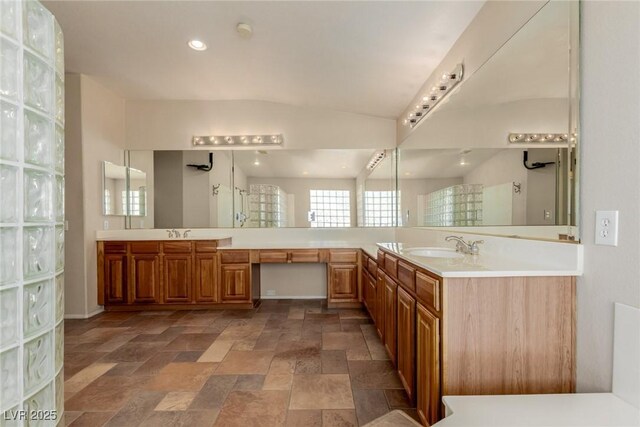 1054 Broomfield Dr, Henderson, NV 89074 - full bath featuring double vanity, stone finish floors, a walk in shower, and recessed lighting