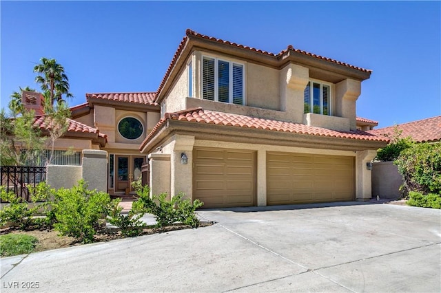 7889 Rancho Mirage Dr, Las Vegas, NV 89113 - mediterranean / spanish house featuring concrete driveway, stucco siding, a garage, and a tiled roof