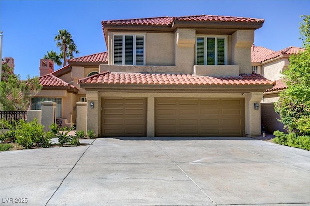 7889 Rancho Mirage Dr, Las Vegas, NV 89113 - view of front of property with concrete driveway, an attached garage, stucco siding, and a tile roof