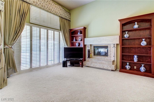 7889 Rancho Mirage Dr, Las Vegas, NV 89113 - carpeted living room featuring a premium fireplace