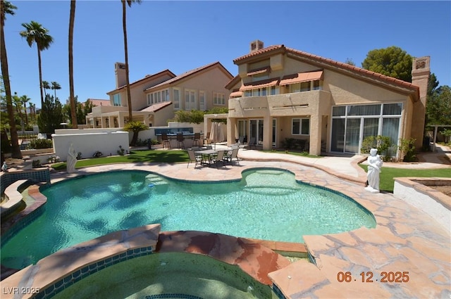 7889 Rancho Mirage Dr, Las Vegas, NV 89113 - view of swimming pool featuring a patio and a pool with connected hot tub