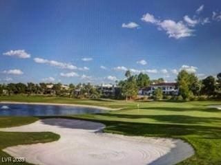 7889 Rancho Mirage Dr, Las Vegas, NV 89113 - view of property's community featuring a putting area, a yard, view of golf course, and a water view