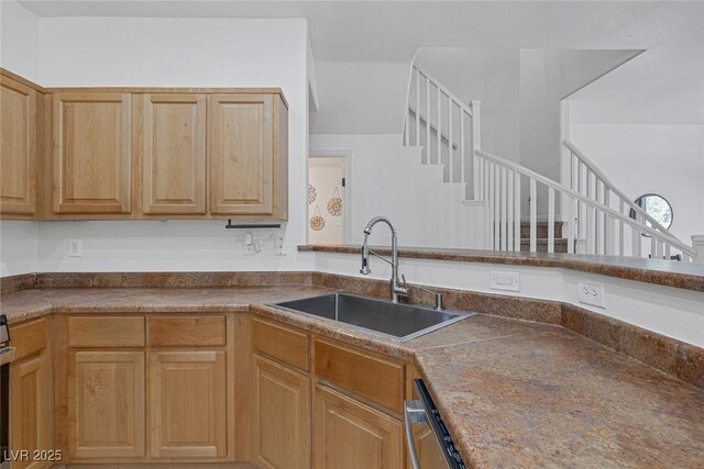 8639 Horizon Wind Ave Unit 102, Las Vegas, NV 89178 - kitchen with a sink and dark countertops