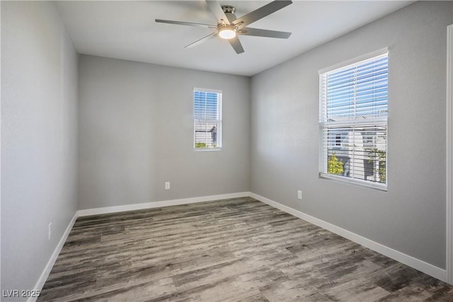 7990 Formitch Ct, Las Vegas, NV 89166 - unfurnished room featuring healthy amount of natural light, ceiling fan, and wood finished floors