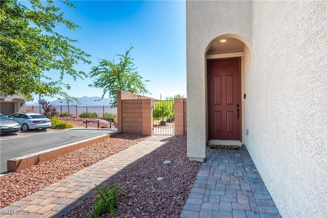 7990 Formitch Ct, Las Vegas, NV 89166 - property entrance featuring stucco siding and a gate