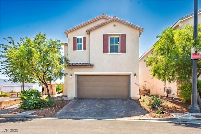 7990 Formitch Ct, Las Vegas, NV 89166 - mediterranean / spanish-style house featuring an attached garage, stucco siding, a tile roof, and decorative driveway