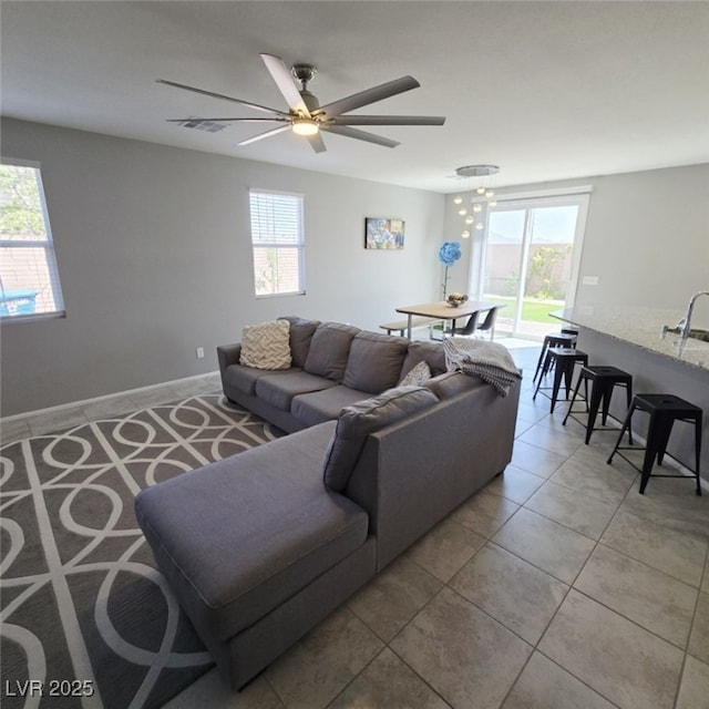 7990 Formitch Ct, Las Vegas, NV 89166 - living area with light tile patterned floors and ceiling fan