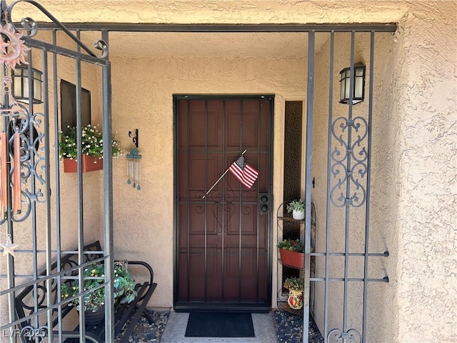 1866 Camino Verde Ln, Las Vegas, NV 89119 - doorway to property featuring stucco siding and a gate