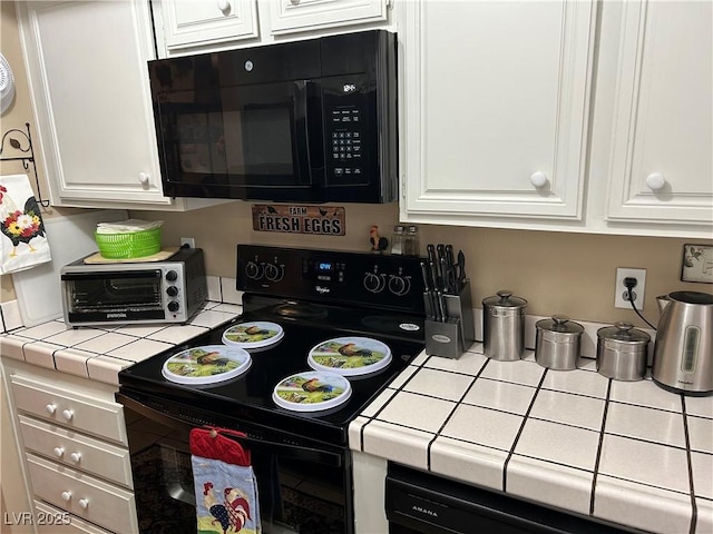 1866 Camino Verde Ln, Las Vegas, NV 89119 - kitchen with black appliances, tile countertops, and white cabinetry