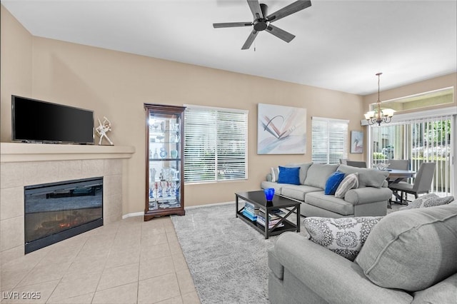 3451 Desert Cliff St Unit 103, Las Vegas, NV 89129 - living room with a chandelier, tile patterned floors, a ceiling fan, and a fireplace