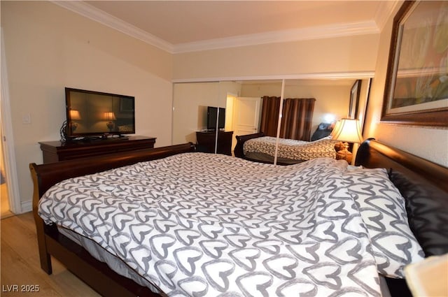 230 E Flamingo Rd Unit 229, Las Vegas, NV 89169 - bedroom with ornamental molding, wood finished floors, and a closet