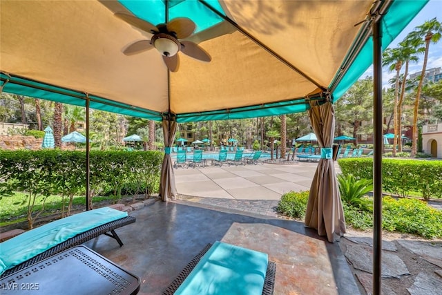 230 E Flamingo Rd Unit 229, Las Vegas, NV 89169 - view of patio featuring a swimming pool, ceiling fan, and a gazebo