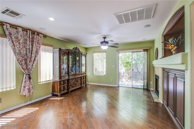 9022 Sosa Creek Ave, Las Vegas, NV 89149 - living room featuring a glass covered fireplace, hardwood / wood-style flooring, ceiling fan, and recessed lighting
