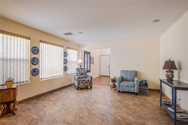 9022 Sosa Creek Ave, Las Vegas, NV 89149 - sitting room with baseboards and stone finish floors