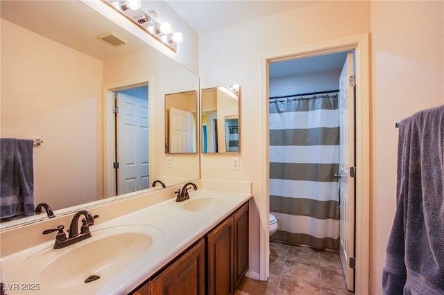 9022 Sosa Creek Ave, Las Vegas, NV 89149 - bathroom featuring toilet and double vanity