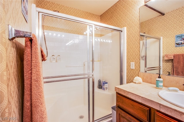 9022 Sosa Creek Ave, Las Vegas, NV 89149 - full bath with vanity, a stall shower, and wallpapered walls