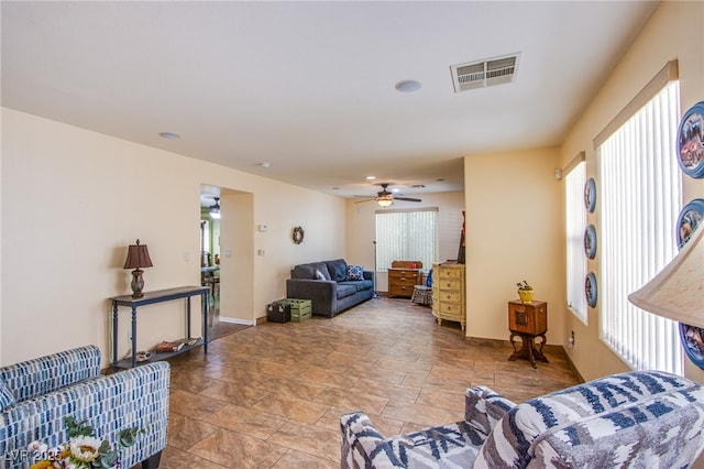9022 Sosa Creek Ave, Las Vegas, NV 89149 - living room with light stone finish floors and a ceiling fan