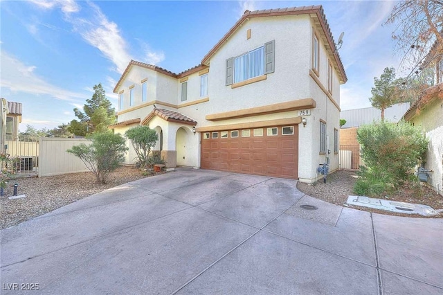 759 Sunrise Crossing St, Henderson, NV 89014 - mediterranean / spanish house featuring an attached garage, stucco siding, a tile roof, and concrete driveway
