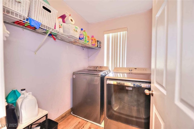 759 Sunrise Crossing St, Henderson, NV 89014 - laundry area featuring washing machine and clothes dryer and light wood-style floors