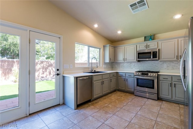 6740 Arctic Breeze St, North Las Vegas, NV 89084 - kitchen with appliances with stainless steel finishes, gray cabinets, decorative backsplash, light tile patterned floors, and recessed lighting